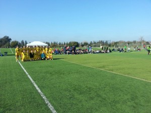 Placer United gets ready to take the field with a sideline full of college coaches.